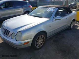 1999 Mercedes-Benz CLK-Class with VIN WDBLK65G6XT006151, listed as a IAAI auction lot 41597025 with 230,751 mi miles. Bid and sale history available at carsss.com. Image 2.