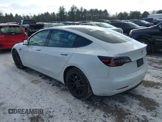 2020 Tesla Model 3 Standard Range Plus with VIN 5YJ3E1EA7LF742973, listed as a IAAI auction lot 41409285 with 48,993 mi miles and . Bid and sale history available at DreamBid. Image 3.