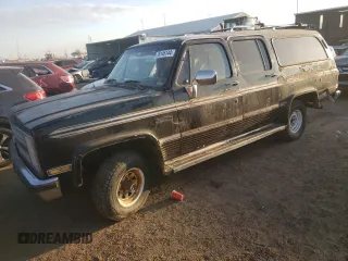 1988 Chevrolet Suburban z VIN 1GBEV16K7JF127952, wystawiony jako Copart lot #76145144 z przebiegiem 942 545 mil mil oraz Czysty tytuł • Clean title. Historia ofert i sprzedaży dostępna na DreamBid. Obrazek 1.