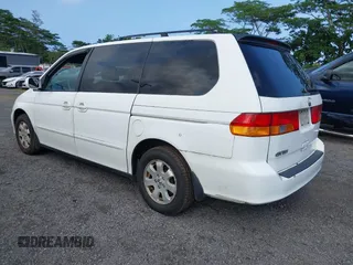 2004 Honda Odyssey EX-L with VIN 5FNRL18924B064040, listed as a IAAI auction lot 41350306 with 130,803 mi miles and . Bid and sale history available at DreamBid. Image 3.