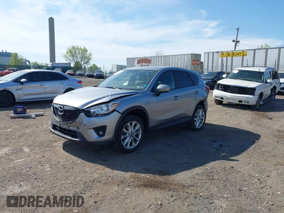2014 Mazda CX-5 Grand Touring with VIN JM3KE4DY7E0311893, listed as a IAAI auction lot 42090872 with 102,154 mi miles and . Bid and sale history available at DreamBid. Image 20.