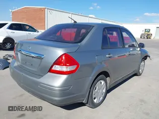 2010 Nissan Versa S with VIN 3N1BC1AP2AL394996, listed as a IAAI auction lot 40690760 with 125,972 mi miles and . Bid and sale history available at DreamBid. Image 4.