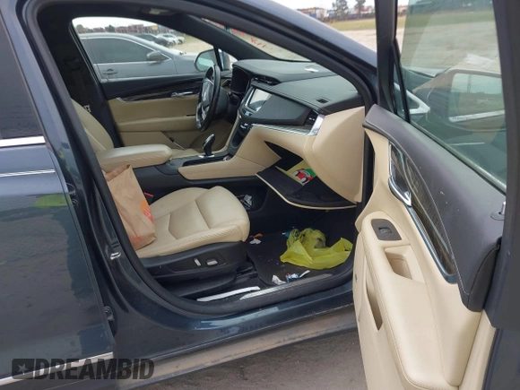 2019 Cadillac XT5 FWD with VIN 1GYKNARS5KZ220991, listed as a IAAI auction lot 41838908 with 75,730 mi miles and . Bid and sale history available at DreamBid. Image 5.