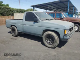 1990 Nissan Frontier with VIN 1N6SD11S9LC321876, listed as a Copart auction lot 59913575 with 119,909 mi miles and Salvage title. Bid and sale history available at DreamBid. Image 4.