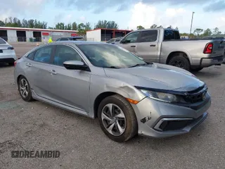 2019 Honda Civic Sedan LX with VIN 2HGFC2F62KH583213, listed as a IAAI auction lot 41935570 with 143,992 mi miles. Bid and sale history available at carsss.com. Image 1.