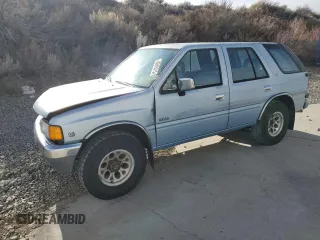 1992 Isuzu Rodeo z VIN 4S2CY58Z2N4341636, wystawiony jako Copart lot #45606315 z przebiegiem 235 683 mil mil oraz Szkody całkowita. Historia ofert i sprzedaży dostępna na DreamBid. Obrazek 1.