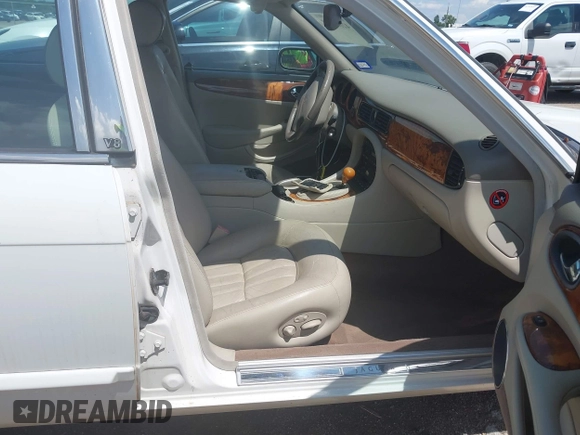 2003 Jaguar XJ 8 with VIN SAJDA14C03LF52338, listed as a IAAI auction lot 42684038 with 142,107 mi miles and . Bid and sale history available at DreamBid. Image 5.