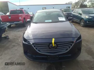 2021 Mazda CX-9 Sport with VIN JM3TCBBY4M0519407, listed as a IAAI auction lot 40883497 with 90,205 mi miles and . Bid and sale history available at carsss.com. Image 13.