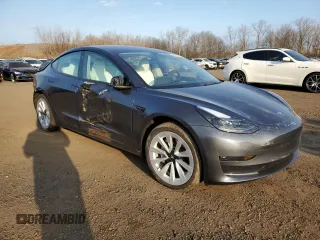 2023 Tesla Model 3 Long Range with VIN 5YJ3E1EBXPF660900, listed as a Copart auction lot 48923265 with 9,954 mi miles and Salvage Title. Bid and sale history available at DreamBid. Image 4.