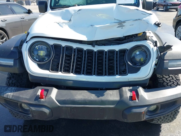2024 Jeep Wrangler Rubicon with VIN 1C4PJXFG6RW291185, listed as a IAAI auction lot 41773050 with 12,400 mi miles and . Bid and sale history available at DreamBid. Image 6.