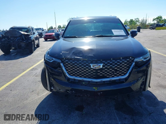 2020 Cadillac XT6 FWD Premium Luxury with VIN 1GYKPCRS7LZ211197, listed as a IAAI auction lot 42231424 with 57,351 mi miles and . Bid and sale history available at DreamBid. Image 6.