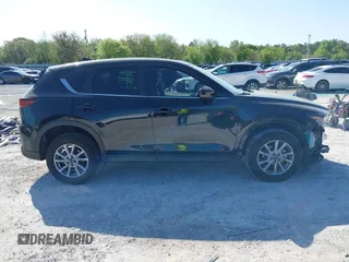 2023 Mazda CX-5 S Preferred with VIN JM3KFBCM7P0188244, listed as a IAAI auction lot 41969630 with 51,058 mi miles and . Bid and sale history available at carsss.com. Image 14.
