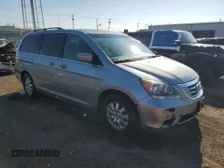 2010 Honda Odyssey EX-L with VIN 5FNRL3H62AB031763, listed as a Copart auction lot 52800055 with 220,450 mi miles and Salvage Title. Bid and sale history available at DreamBid. Image 4.