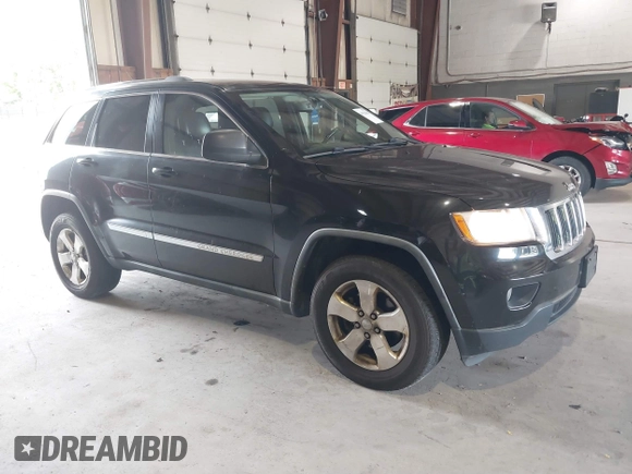 2012 Jeep Grand Cherokee Laredo with VIN 1C4RJFAT8CC182128, listed as a IAAI auction lot 40154044 with 239,601 mi miles. Bid and sale history available at carsss.com. Image 1.