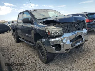 2010 Nissan Titan XE with VIN 1N6BA0EJ5AN318639, listed as a Copart auction lot 69776984 with 158,913 mi miles and Salvage Title. Bid and sale history available at carsss.com. Image 4.