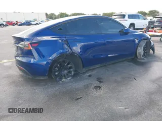 2021 Tesla Model Y Standard Range with VIN 5YJYGDED4MF112857, listed as a IAAI auction lot 41134600 with Not Provided miles and . Bid and sale history available at DreamBid. Image 4.