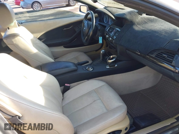 2006 BMW 6 Series 650Ci z VIN WBAEK13446CN77929, wystawiony jako IAAI lot #41853425 z przebiegiem 133 515 mil mil oraz . Historia ofert i sprzedaży dostępna na DreamBid. Obrazek 5.