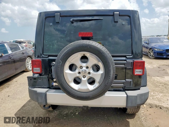 2015 Jeep Wrangler Unlimited Sahara with VIN 1C4BJWEG4FL668339, listed as a Copart auction lot 61221325 with 117,887 mi miles and Salvage title. Bid and sale history available at DreamBid. Image 6.