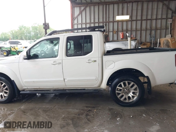 2011 Nissan Frontier Pro-4X with VIN 1N6AD0EV3BC409184, listed as a IAAI auction lot 42122823 with 209,669 mi miles and . Bid and sale history available at DreamBid. Image 14.