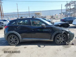2016 Mazda CX-3 Grand Touring z VIN JM1DKBD73G0111148, wystawiony jako IAAI lot #42260375 z przebiegiem Nie podano mil oraz . Historia ofert i sprzedaży dostępna na DreamBid. Obrazek 12.