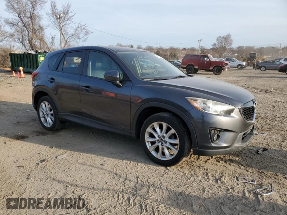 2014 Mazda CX-5 Grand Touring with VIN JM3KE4DY5E0372787, listed as a Copart auction lot 48873675 with 136,784 mi miles and Salvage Title. Bid and sale history available at carsss.com. Image 4.