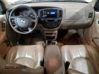 2001 Mazda Tribute LX with VIN 4F2CU08101KM05943, listed as a Copart auction lot 84077694 with 137,937 mi miles and Salvage Title. Bid and sale history available at DreamBid. Image 8.