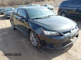 2013 Scion tC with VIN JTKJF5C74D3063012, listed as a IAAI auction lot 41776592 with 142,071 mi miles. Bid and sale history available at carsss.com. Image 1.