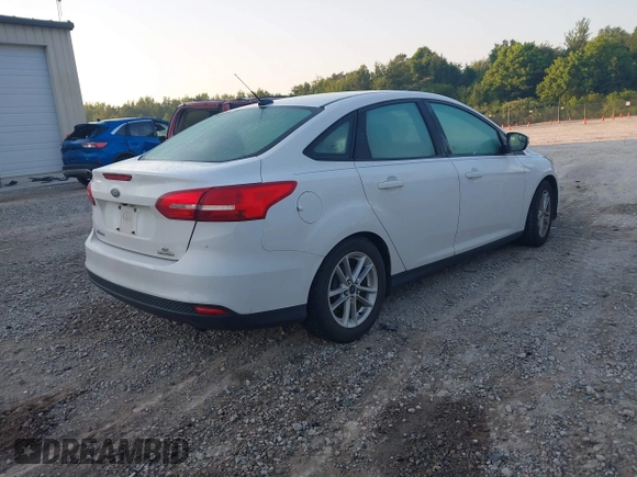 2016 Ford Focus SE z VIN 1FADP3F22GL355984, wystawiony jako IAAI lot #42564516 z przebiegiem 128 002 mil mil oraz . Historia ofert i sprzedaży dostępna na DreamBid. Obrazek 4.