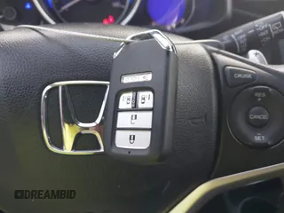 2015 Honda Fit EX-L z VIN 3HGGK5H8XFM733048, wystawiony jako IAAI lot #42267517 z przebiegiem Nie podano mil oraz . Historia ofert i sprzedaży dostępna na DreamBid. Obrazek 11.