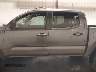 2019 Toyota Tacoma SR with VIN 5TFCZ5AN7KX208672, listed as a IAAI auction lot 42143071 with 83,584 mi miles and . Bid and sale history available at DreamBid. Image 15.