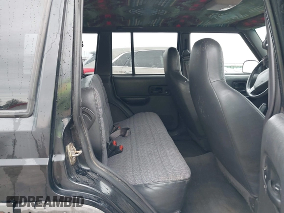 1999 Jeep Cherokee Sport with VIN 1J4FT68S6XL598558, listed as a IAAI auction lot 41549504 with 238,004 mi miles. Bid and sale history available at carsss.com. Image 8.