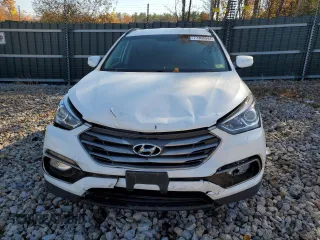 2017 Hyundai Santa Fe 2.0T z VIN 5XYZUDLA3HG397569, wystawiony jako Copart lot #77360944 z przebiegiem 145 512 mil mil oraz Szkoda całkowita • Salvage title. Historia ofert i sprzedaży dostępna na DreamBid. Obrazek 5.