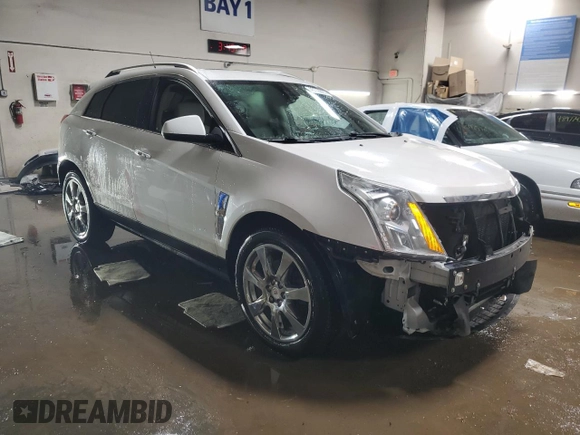2010 Cadillac SRX Premium Collection with VIN 3GYFNFEY5AS581805, listed as a Copart auction lot 48716805 with 102,877 mi miles and Salvage title. Bid and sale history available at DreamBid. Image 4.