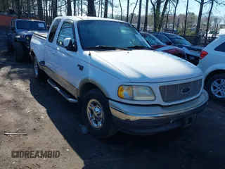 2000 Ford F-150 XL z VIN 1FTRX07L1YKA25749, wystawiony jako IAAI lot #41847308 z przebiegiem 285 702 mil mil oraz . Historia ofert i sprzedaży dostępna na DreamBid. Obrazek 1.