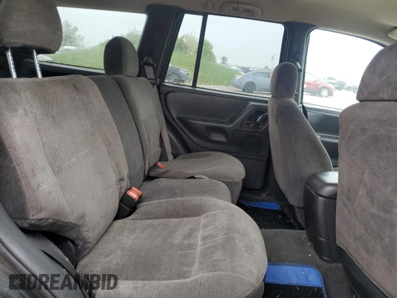 2000 Jeep Grand Cherokee Laredo z VIN 1J4GW48S1YC326453, wystawiony jako Copart lot #57332675 z przebiegiem 290 059 mil mil oraz Czysty tytuł • Clean title. Historia ofert i sprzedaży dostępna na DreamBid. Obrazek 11.