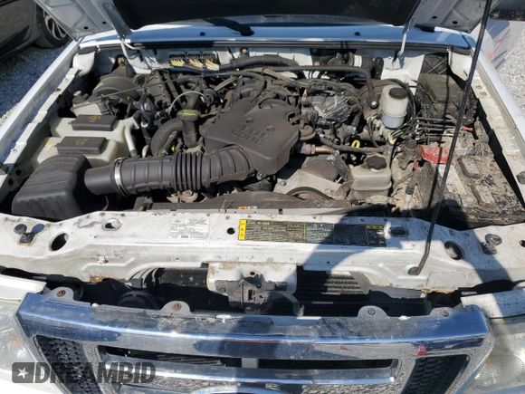 2009 Ford Ranger XLT z VIN 1FTZR45E99PA14864, wystawiony jako Copart lot #53185635 z przebiegiem 129 070 mil mil oraz Szkoda całkowita • Salvage title. Historia ofert i sprzedaży dostępna na DreamBid. Obrazek 11.