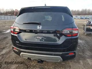 2024 Honda Pilot EX-L 7 Passenger with VIN 5FNYG1H51RB019899, listed as a Copart auction lot 82653994 with 7,399 mi miles and Salvage Title. Bid and sale history available at carsss.com. Image 6.