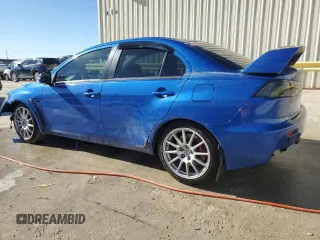 2015 Mitsubishi Lancer Evolution GSR with VIN JA32W8FV6FU006930, listed as a Copart auction lot 84628474 with 116,819 mi miles and Salvage Title. Bid and sale history available at carsss.com. Image 2.