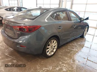 2014 Mazda 3 S Grand Touring with VIN JM1BM1W31E1182703, listed as a IAAI auction lot 41470742 with 123,956 mi miles and . Bid and sale history available at DreamBid. Image 4.