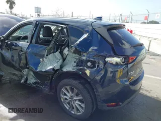2021 Mazda CX-5 Grand Touring with VIN JM3KFBDM6M1312573, listed as a IAAI auction lot 41936739 with Not Provided miles and . Bid and sale history available at DreamBid. Image 6.
