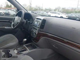 2012 Hyundai Santa Fe SE with VIN 5XYZHDAG4CG113063, listed as a IAAI auction lot 41971620 with 228,796 mi miles. Bid and sale history available at carsss.com. Image 5.