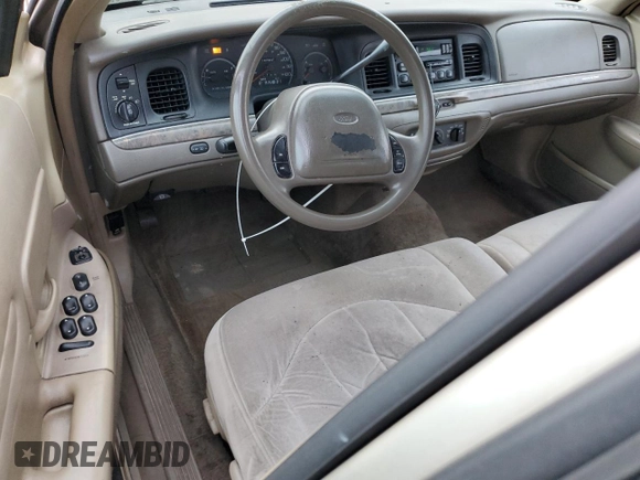 1999 Ford Crown Victoria z VIN 2FAFP73W4XX137040, wystawiony jako Copart lot #83741244 z przebiegiem 142 901 mil mil oraz Szkoda całkowita • Salvage title. Historia ofert i sprzedaży dostępna na DreamBid. Obrazek 8.