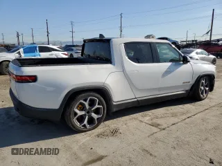 2022 Rivian R1T Adventure z VIN 7FCTGAAA9NN014280, wystawiony jako Copart lot #49723355 z przebiegiem 28 601 mil mil oraz Szkody całkowita. Historia ofert i sprzedaży dostępna na DreamBid. Obrazek 3.