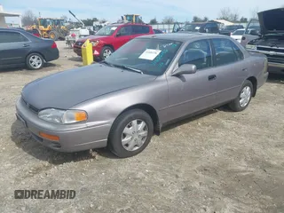 1996 Toyota Camry DX with VIN 4T1BG12K8TU762073, listed as a IAAI auction lot 41606136 with 254,939 mi miles. Bid and sale history available at carsss.com. Image 2.