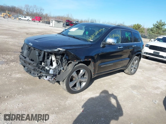 2014 Jeep Grand Cherokee Overland with VIN 1C4RJECG4EC523747, listed as a IAAI auction lot 40802143 with 124,079 mi miles. Bid and sale history available at carsss.com. Image 2.