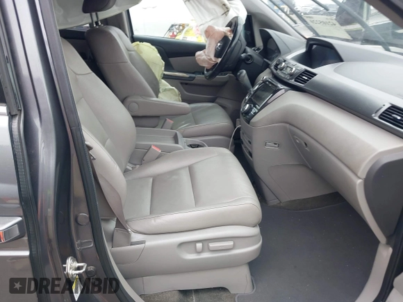 2014 Honda Odyssey Touring with VIN 5FNRL5H97EB114634, listed as a IAAI auction lot 42105220 with Not Provided miles and . Bid and sale history available at carsss.com. Image 5.