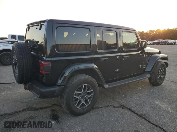 2024 Jeep Wrangler Sahara with VIN 1C4PJXENXRW118401, listed as a Copart auction lot 84731534 with 6,895 mi miles and Salvage Title. Bid and sale history available at DreamBid. Image 3.