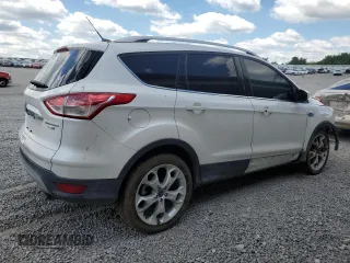 2015 Ford Escape Titanium z VIN 1FMCU9J90FUC41606, wystawiony jako Copart lot #57458455 z przebiegiem 71 671 mil mil oraz Szkoda całkowita • Salvage title. Historia ofert i sprzedaży dostępna na DreamBid. Obrazek 3.