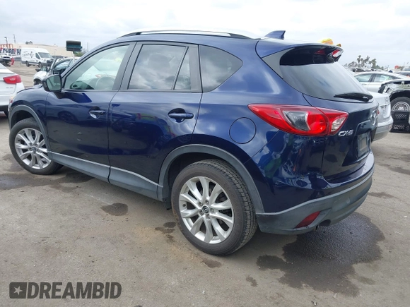 2014 Mazda CX-5 Grand Touring with VIN JM3KE2DY1E0307911, listed as a IAAI auction lot 42064898 with 133,934 mi miles. Bid and sale history available at carsss.com. Image 3.
