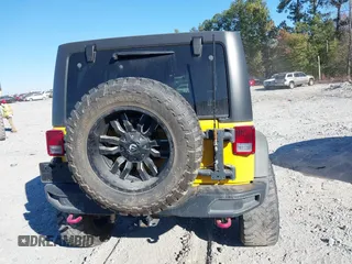 2015 Jeep Wrangler Unlimited Rubicon z VIN 1C4BJWFG4FL681946, wystawiony jako IAAI lot #40809597 z przebiegiem 57 148 mil mil oraz . Historia ofert i sprzedaży dostępna na DreamBid. Obrazek 16.